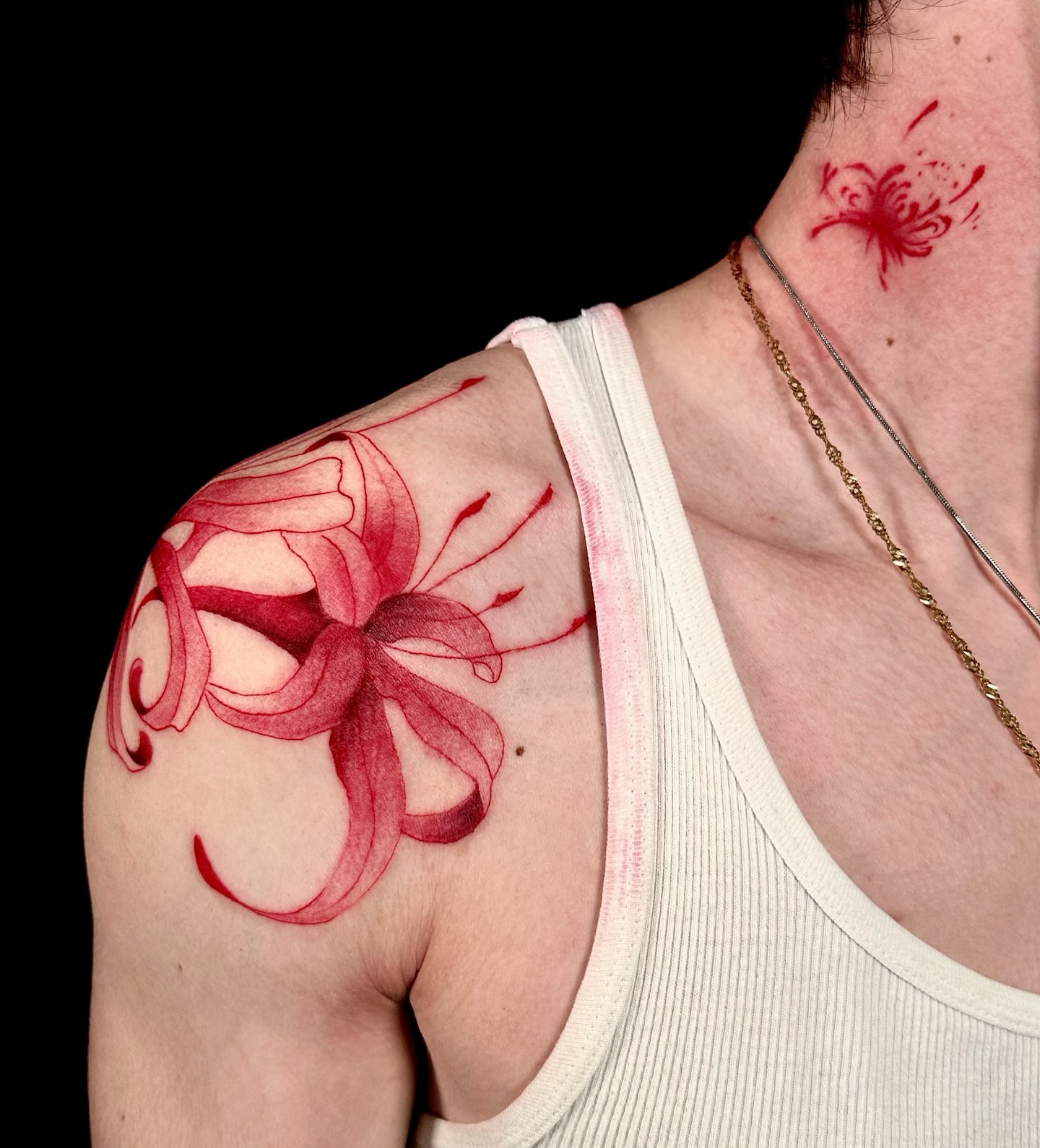 Flower watercolor tattoo on the shoulder by Abi