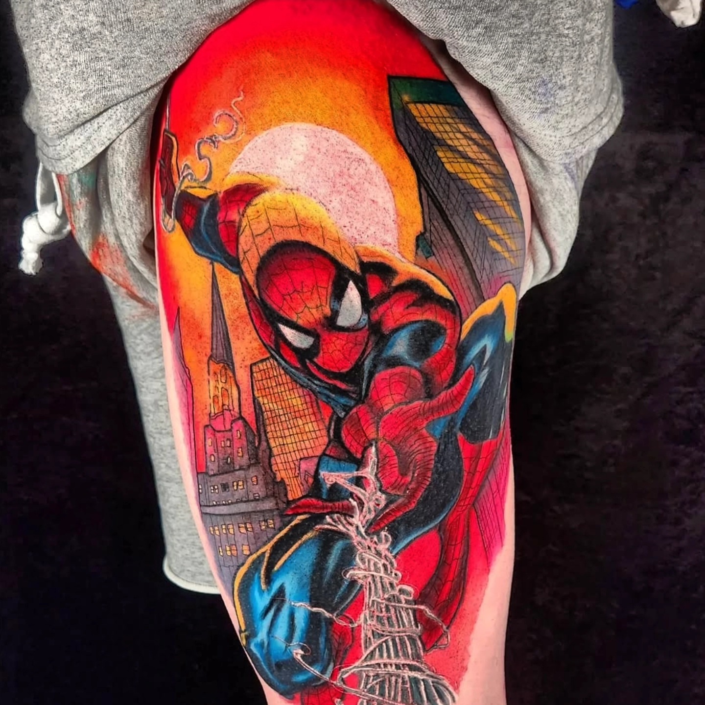 Spider-man new school tattoo on the thigh by Chris Bowen