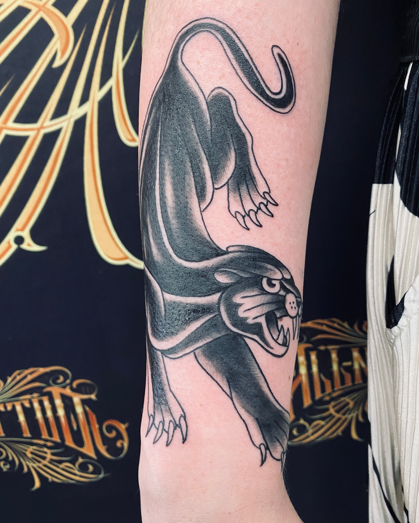 Panther black and grey tattoo on the forearm by Nessa, Las Vegas, Nevada