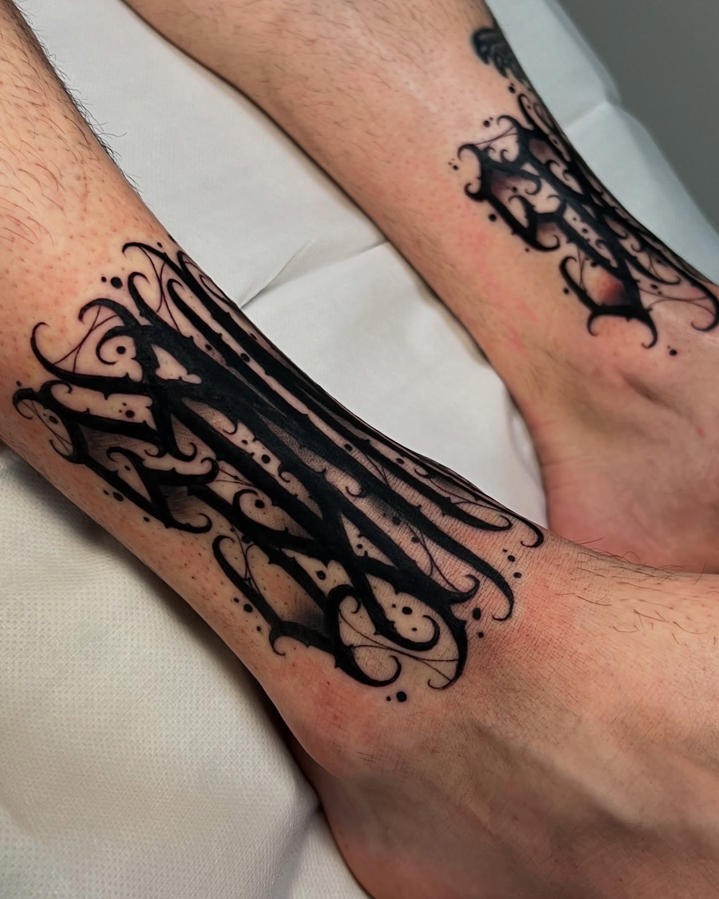 Scrollwork ornamental tattoo on the forearm by James Foltz