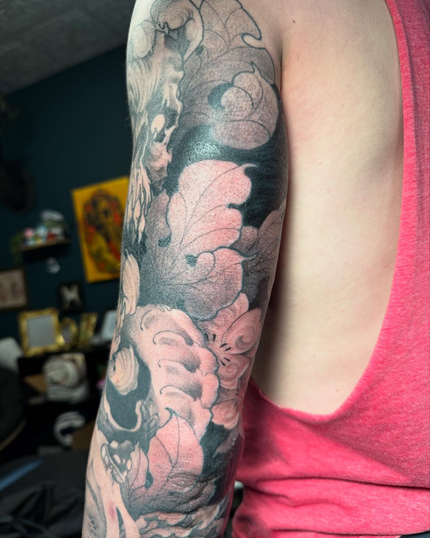 Floral bouquet dotwork tattoo on the upper arm by Tayler Beetison