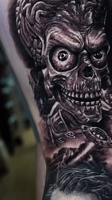 Martian skull with UFOs realism tattoo by Ryan Gage Gonzalez