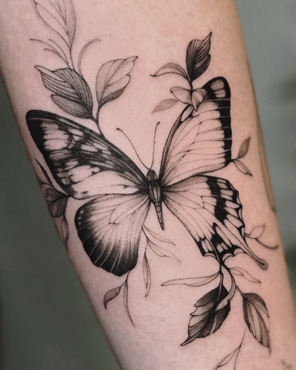Butterfly realism tattoo on the forearm by Angel