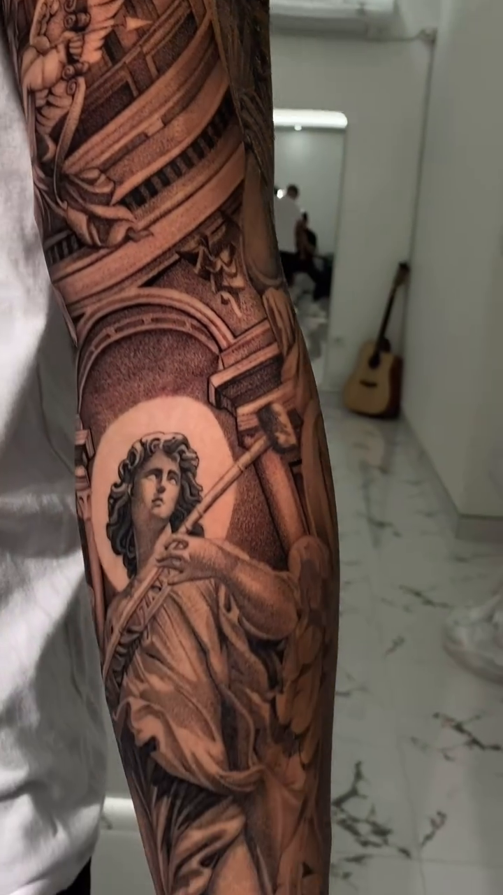 Angelic figure with architectural elements realism tattoo by Viktor Govorukhin