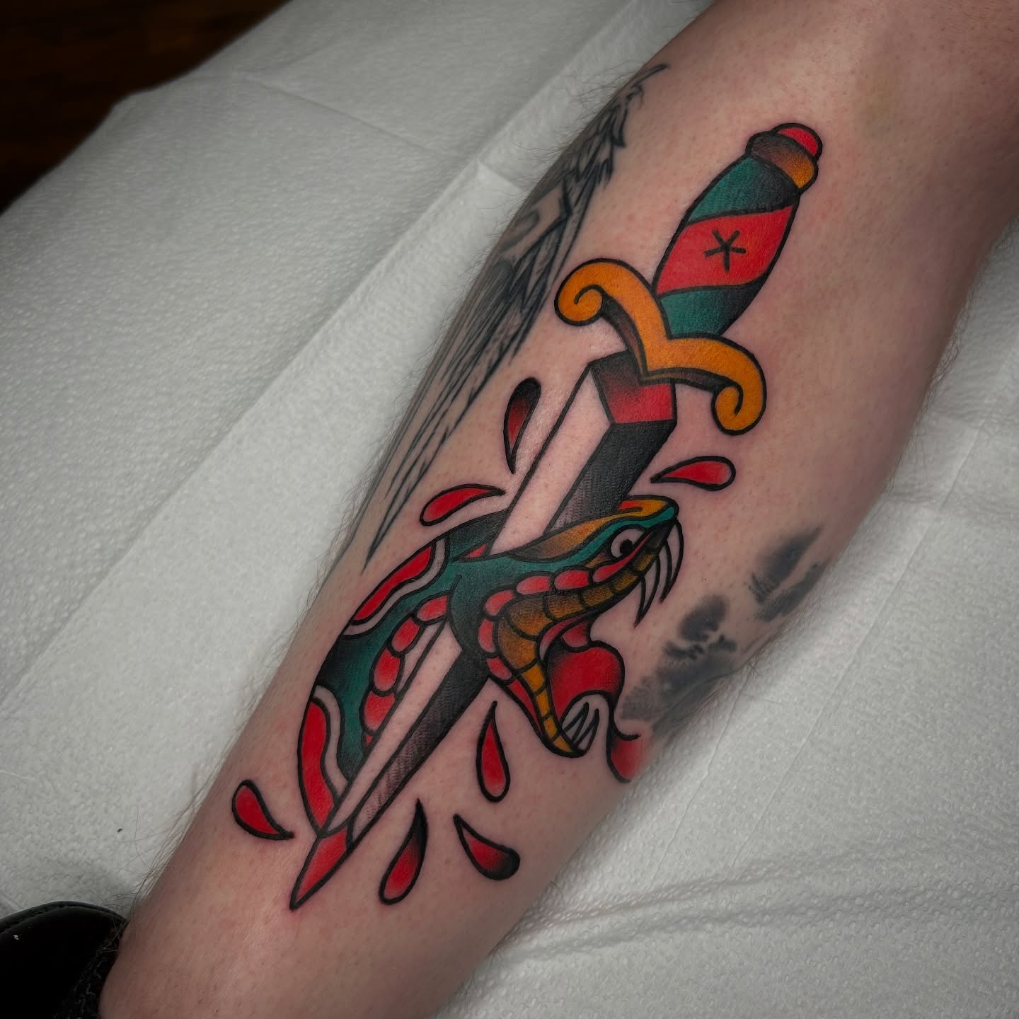 Sword and snake American traditional tattoo on the forearm by Bright-bold-classic Tattoos, North Hills