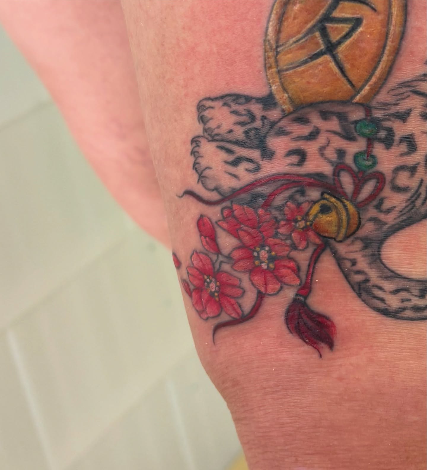 Dragon and cherry blossoms japanese irezumi tattoo on the forearm by Ivanna