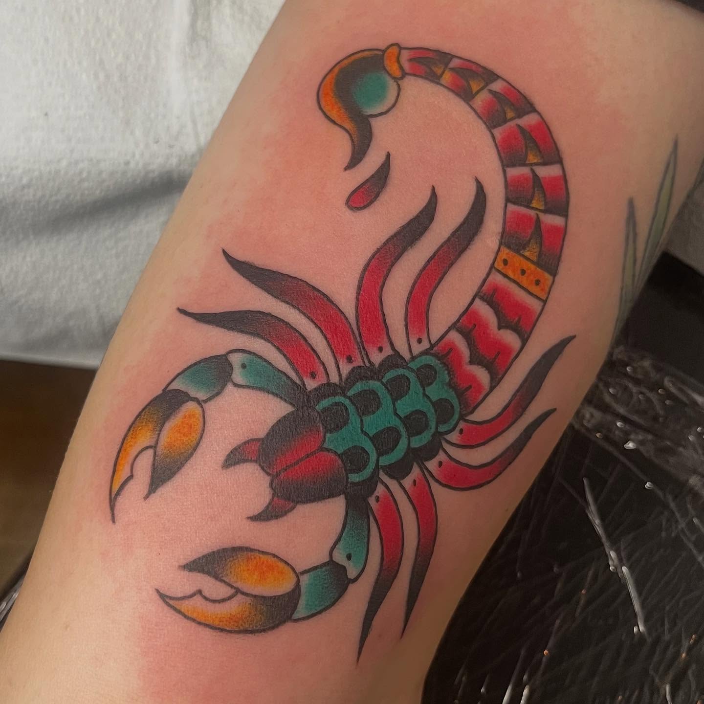 Scorpion American traditional tattoo on the thigh by Mariah Nguyen