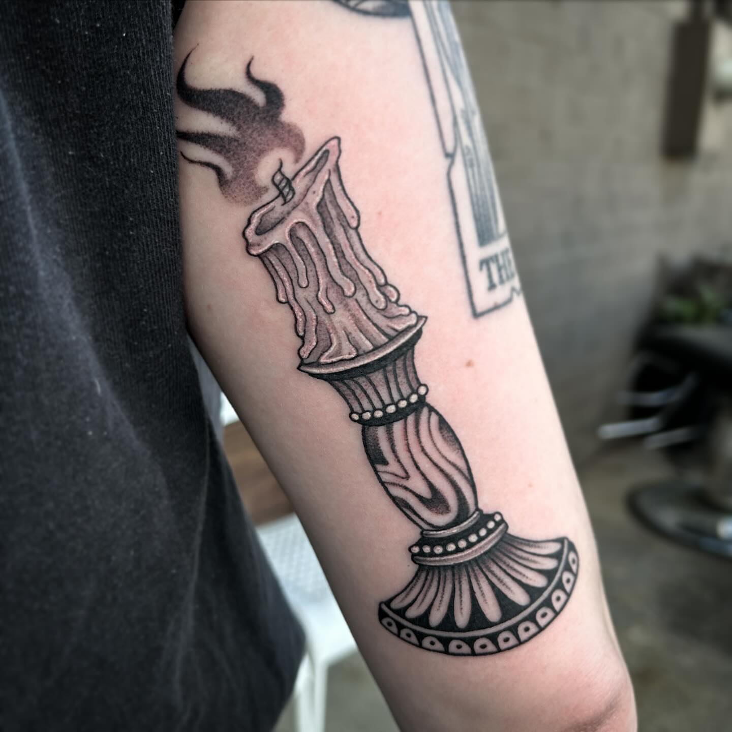 Candle black and grey tattoo on the forearm by Kayla Shoffner