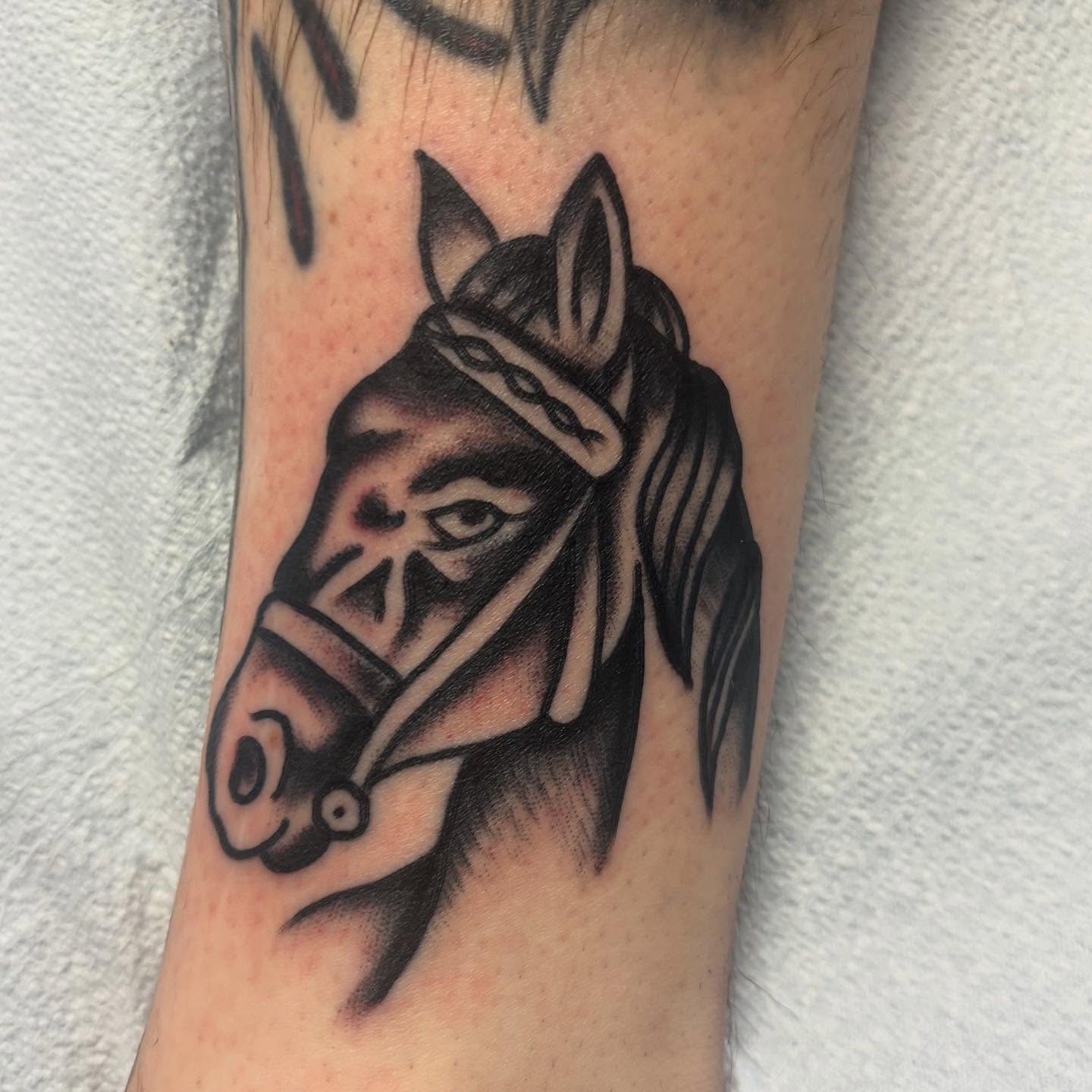 Horse head black and grey tattoo on the forearm by 18 and older High End Tattoo