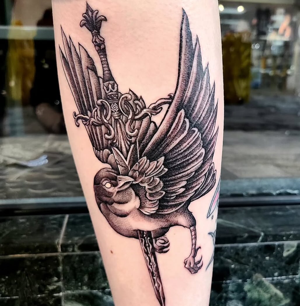 Phoenix and sword realism tattoo on the forearm by Sydney Paige, Mentor, Ohio