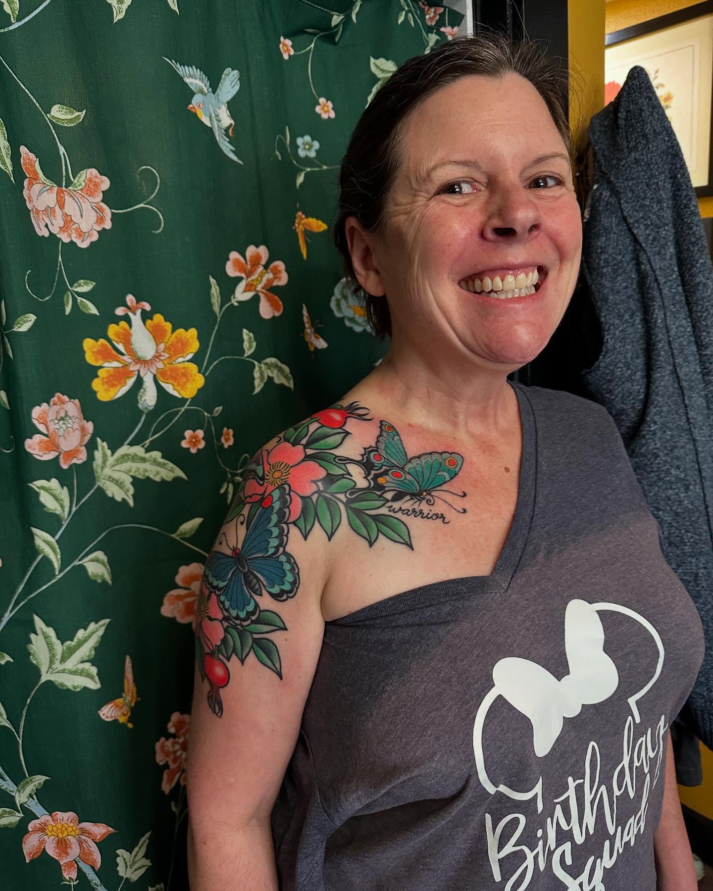 Butterfly and floral American traditional tattoo on the shoulder by Megon Shore, Seattle, Washington
