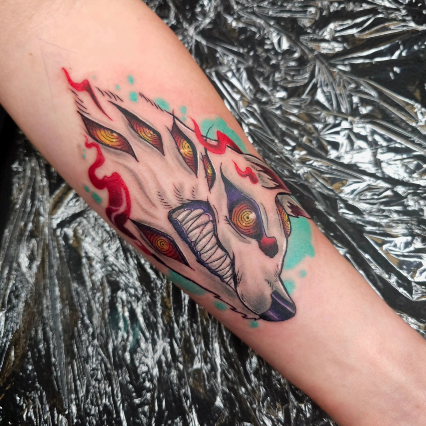 Demon mask American traditional tattoo on the forearm by Devan Vankirk