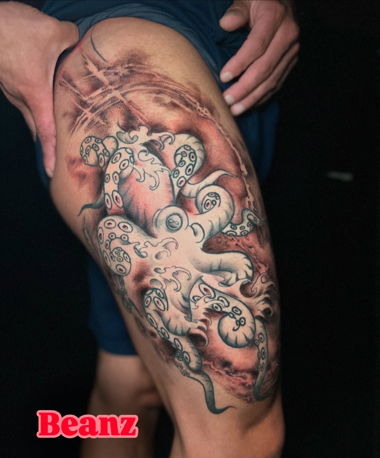 Octopus realism tattoo on the thigh by Alex