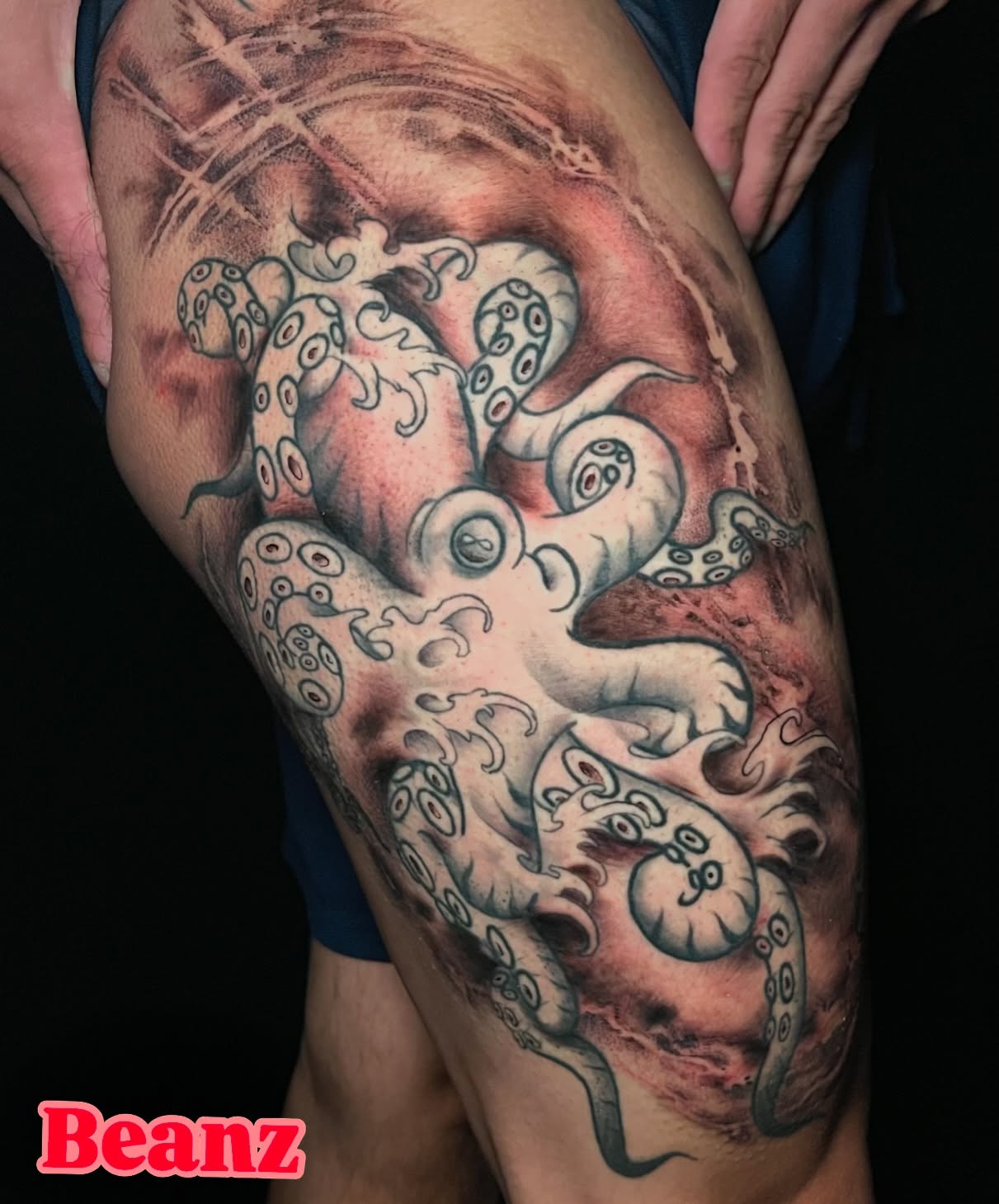 Octopus realism tattoo on the thigh by Alex