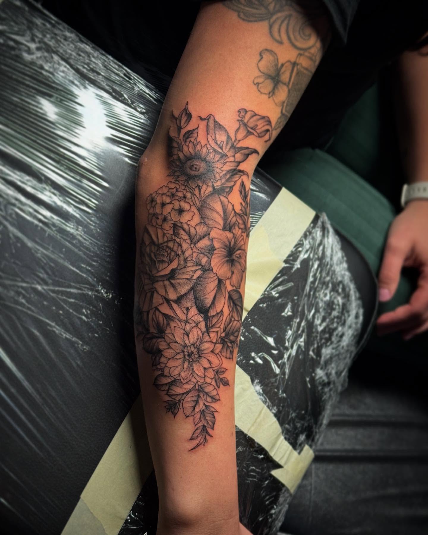 Floral arrangement black and grey tattoo on the forearm by AaronAdlerTattoos.com, Cincinnati