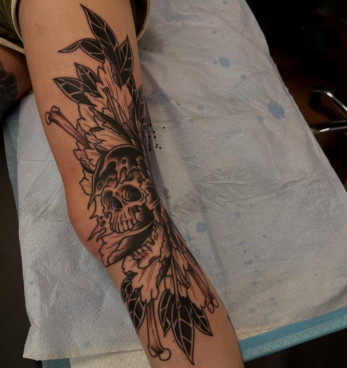 Skull with wings American traditional tattoo on the forearm by Lee Brewster, Erlanger, Kentucky