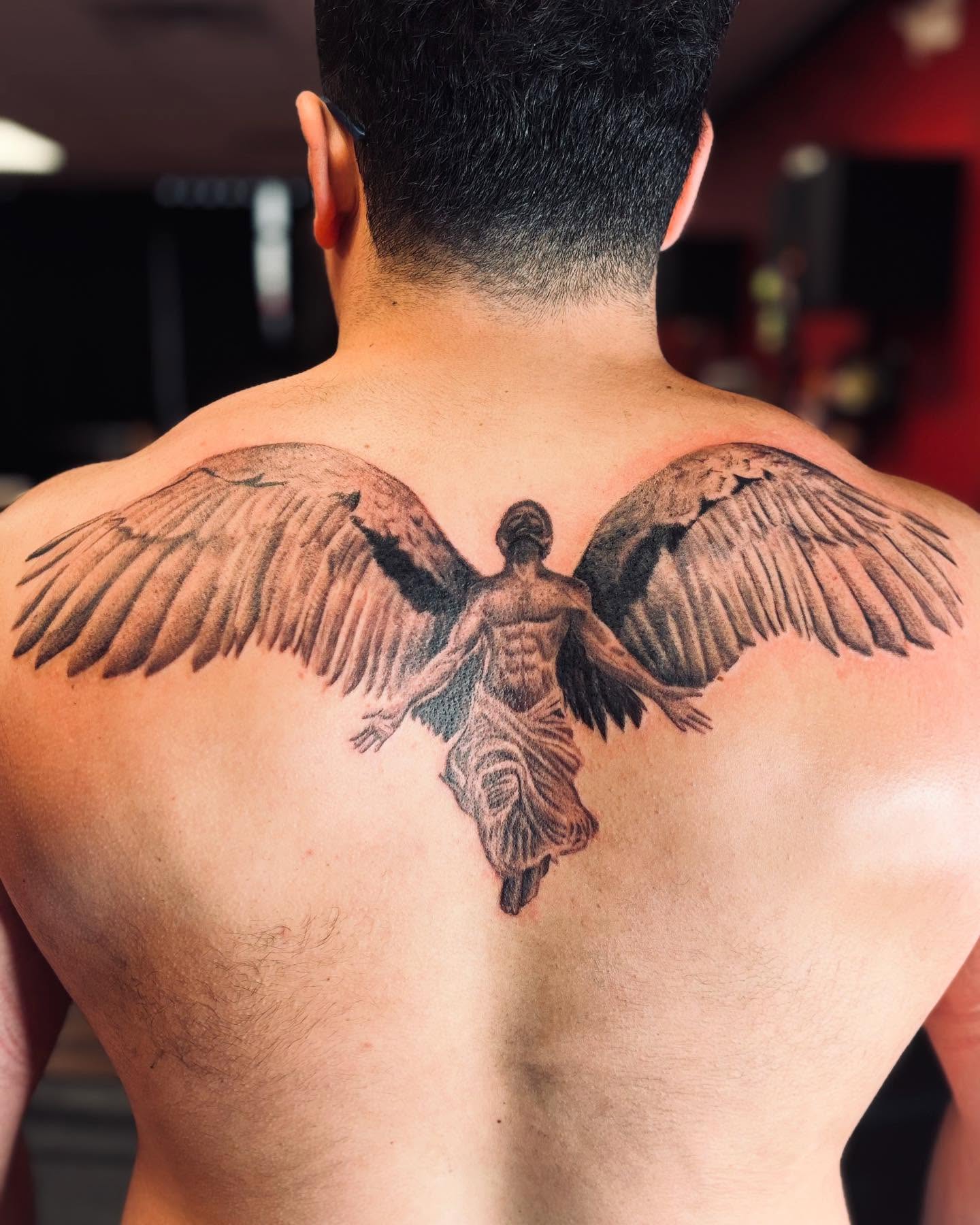 Angel realism tattoo on the back by Dre Ortiz