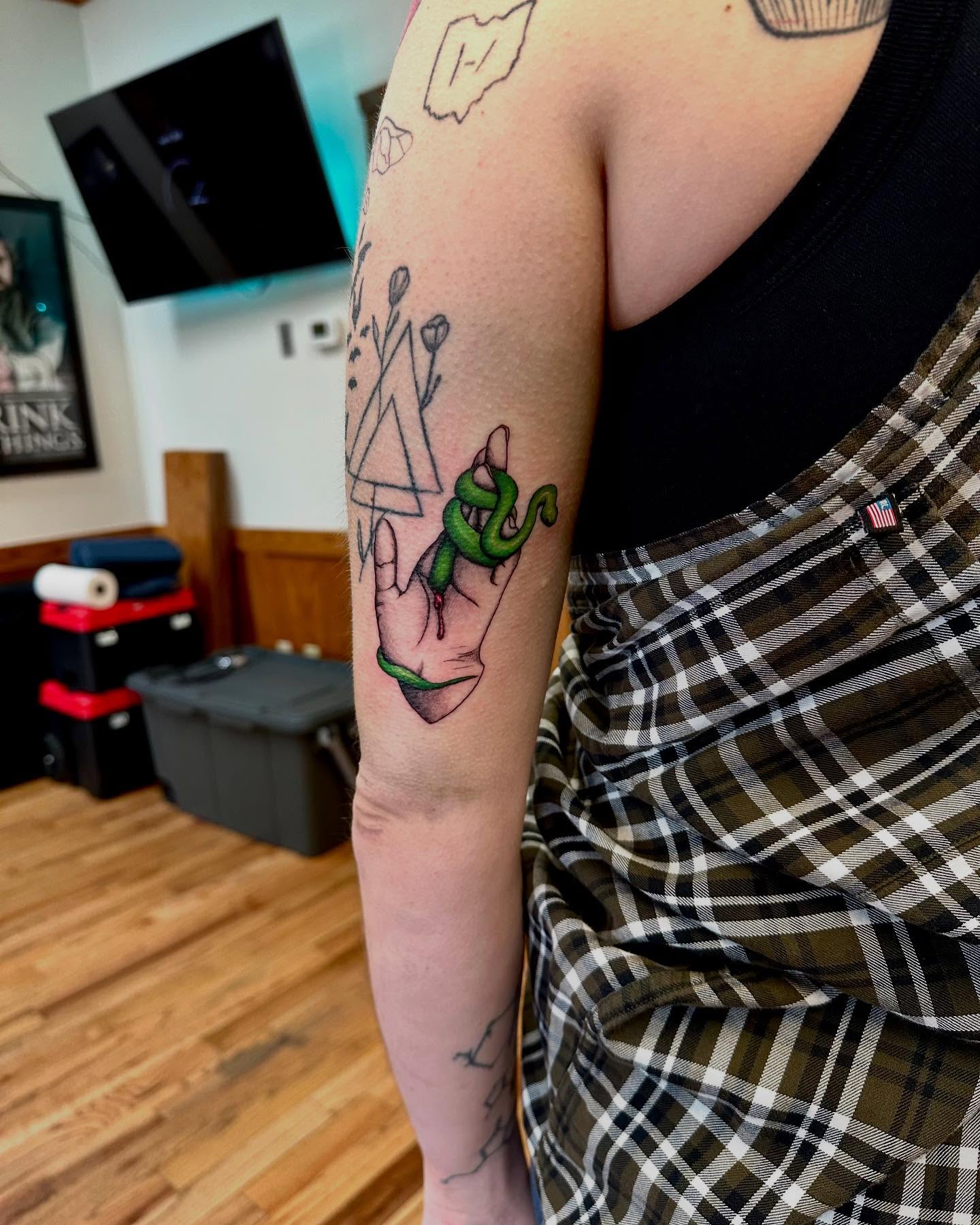 Snake and hand geometric tattoo on the forearm by Marie Novotny, Lakewood, Ohio