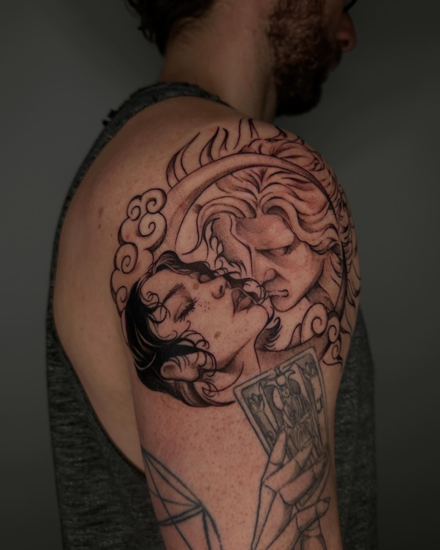 Kissing couple realism tattoo on the shoulder by A L e X