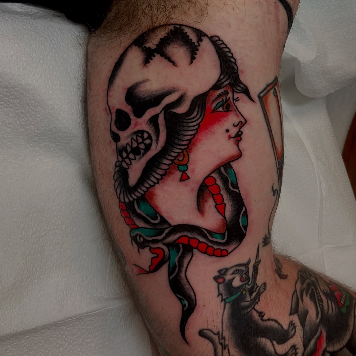 Woman with skull American traditional tattoo on the forearm by Texas Jonah