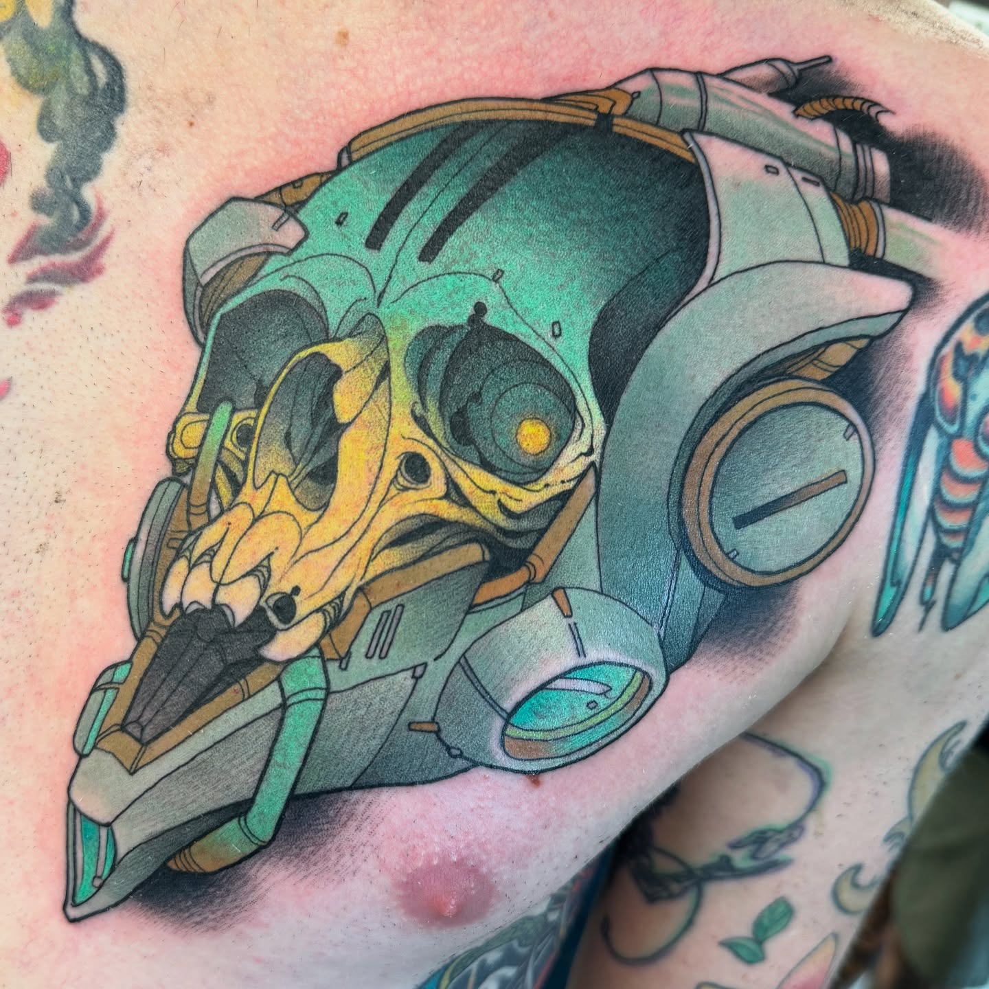 Mech skull geometric tattoo on the shoulder by Emmanuel Mendoza