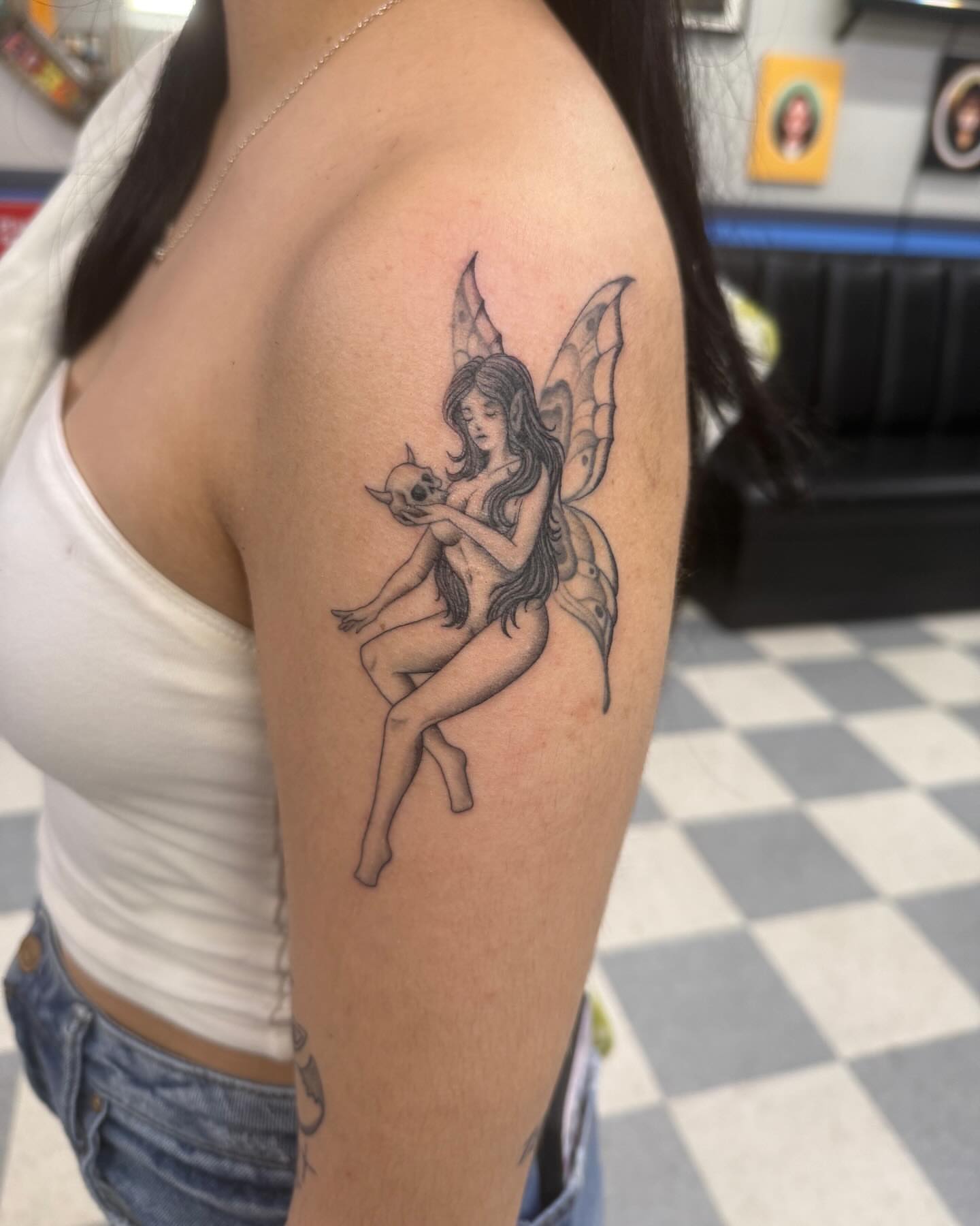 Fairy black and grey tattoo on the shoulder by Manny