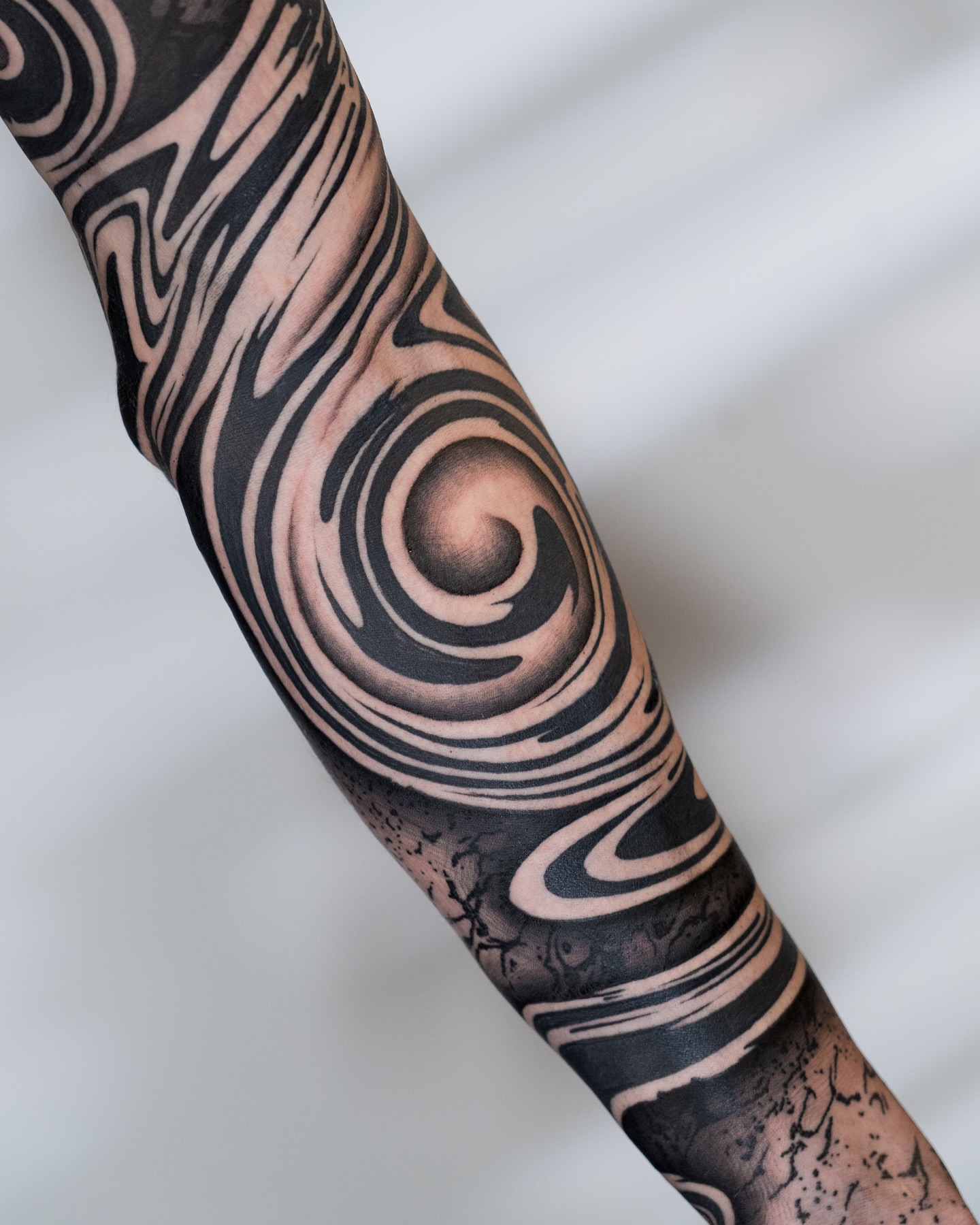 Swirling pattern geometric tattoo on the forearm by Katie Mizuno, Berkeley, California