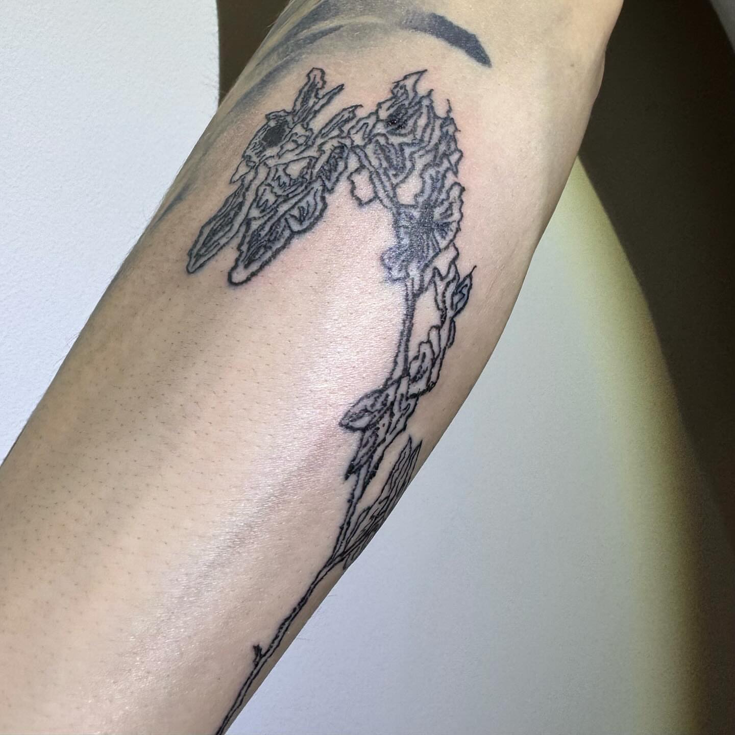 Mechanical figure black and grey tattoo on the forearm by @godsfirmgrip
