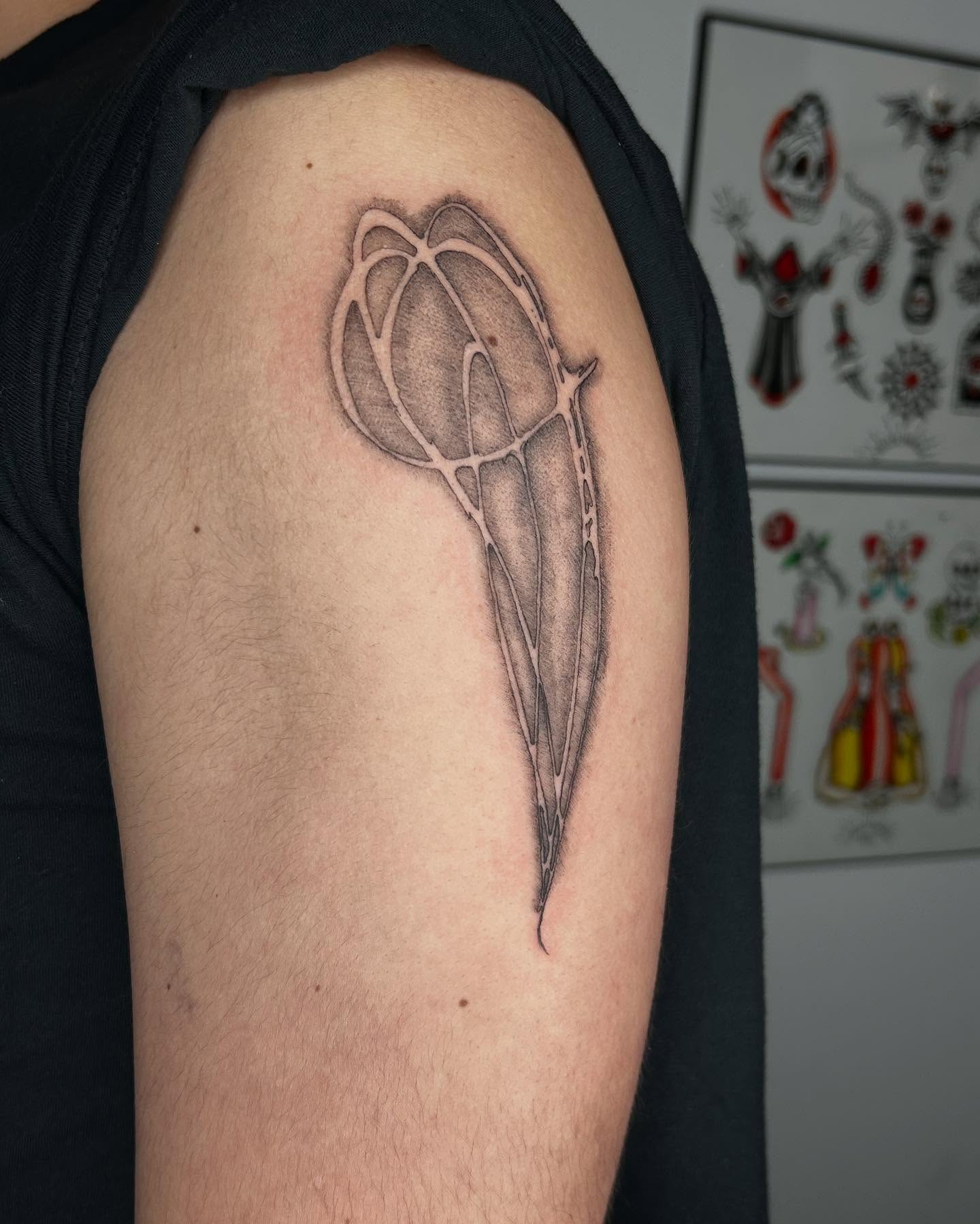 Bird skull black and grey tattoo on the upper arm by Jadin Nichols