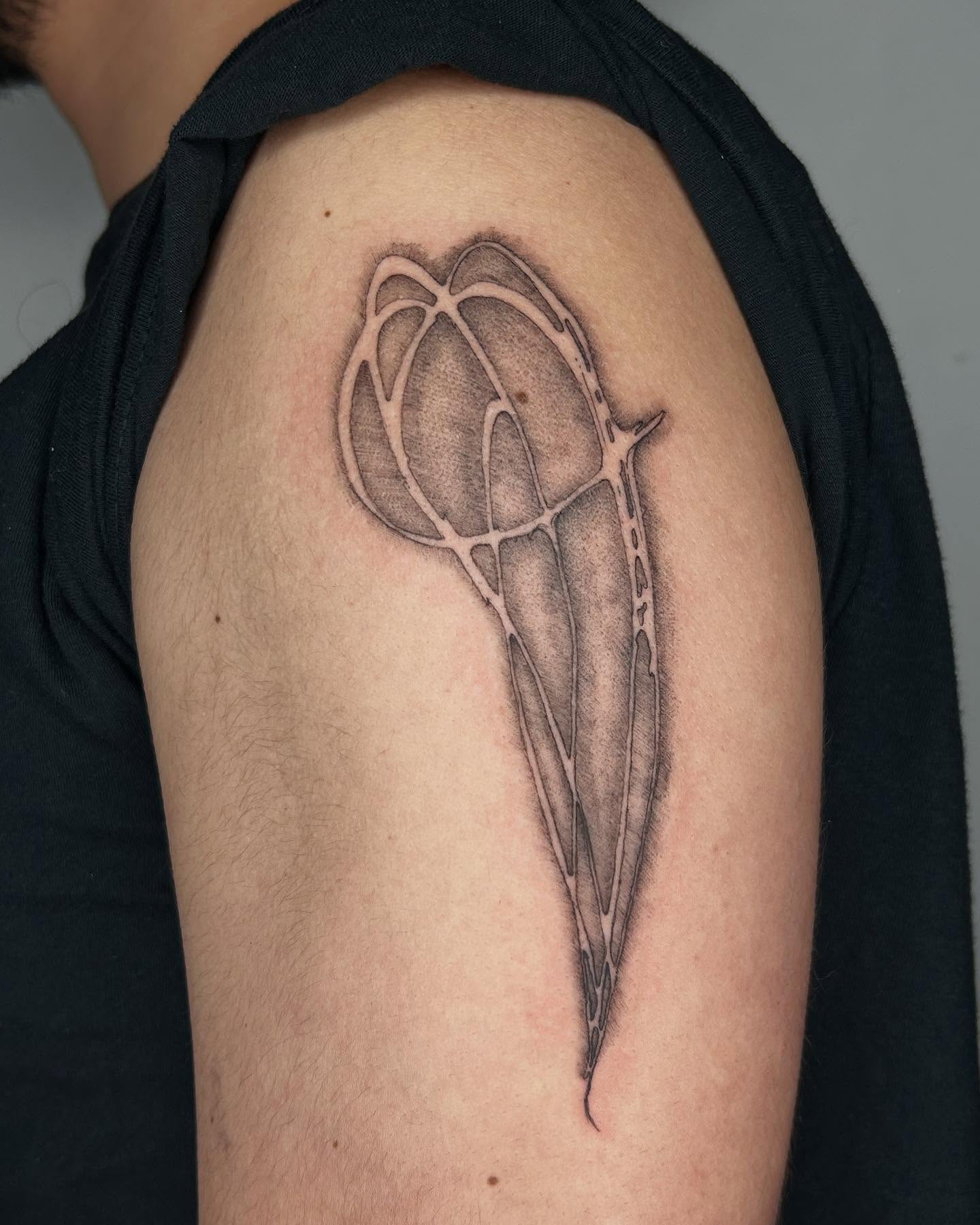 Basketball dotwork tattoo on the shoulder by Jadin Nichols