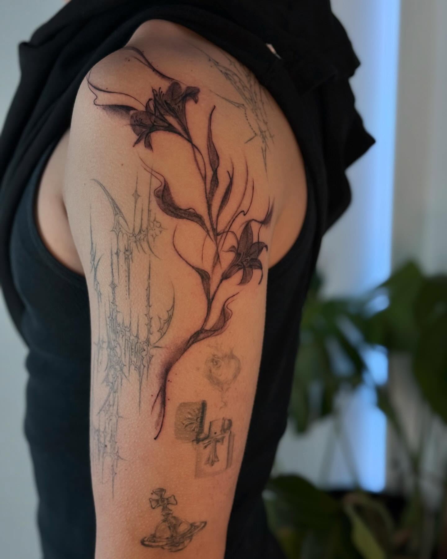Lily and cross black and grey tattoo on the upper arm by thuy (twee) <3, San Jose, California