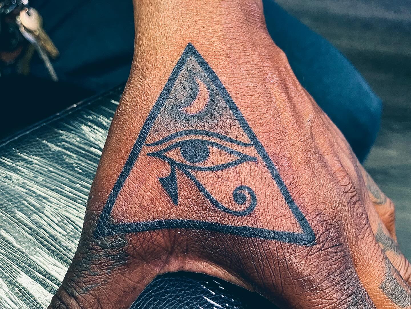 Eye of horus geometric tattoo on the forearm by Tiffany