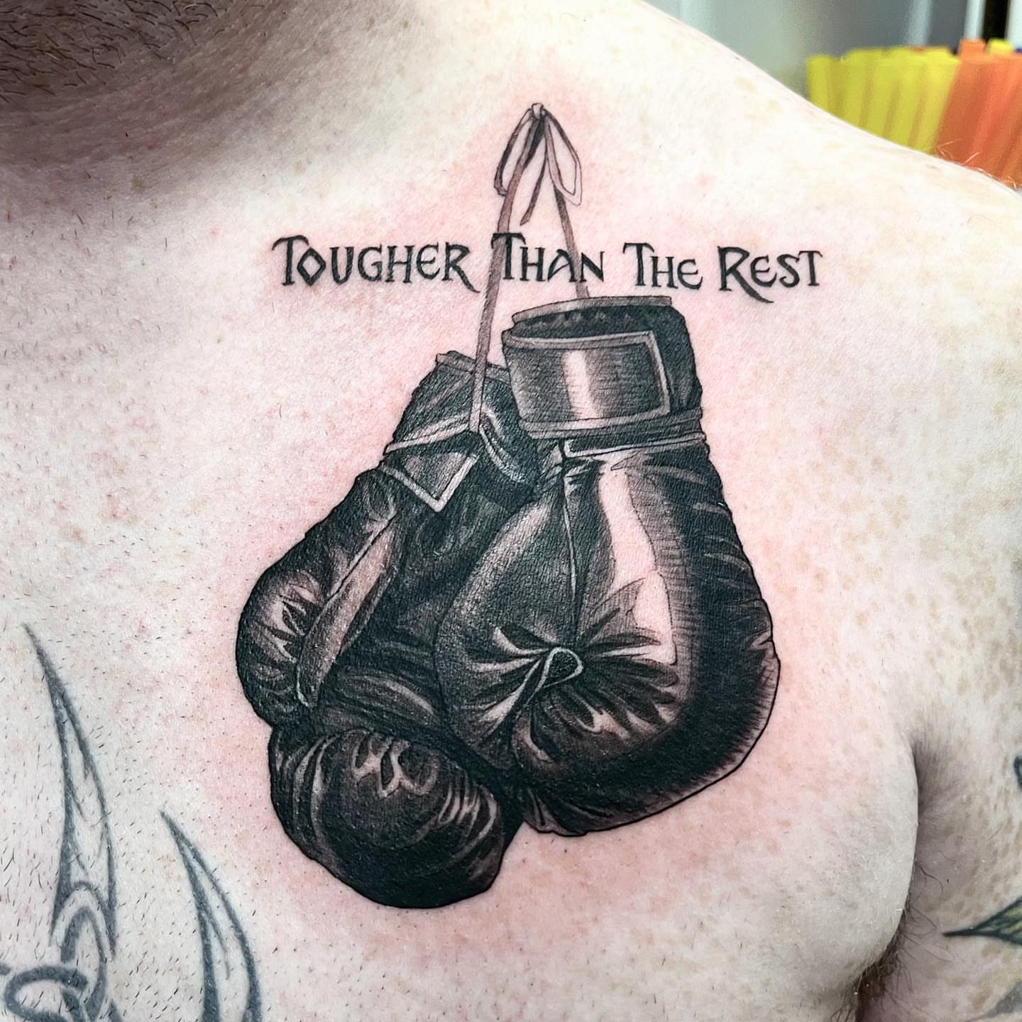 Boxing gloves black and grey tattoo on the back by π‘πΆπΈπ½ππ ππΎππππ