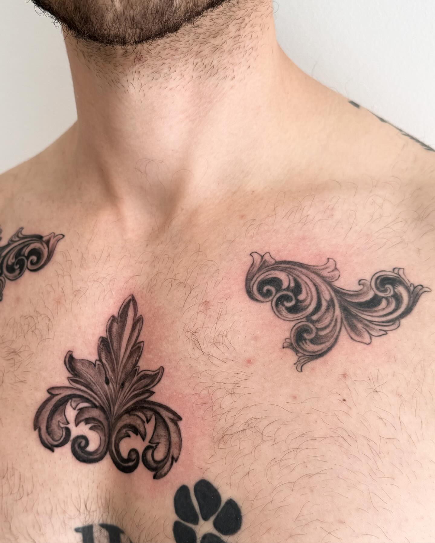 Scrollwork black and grey tattoo on the chest by ⛓Ireland tattoo⛓