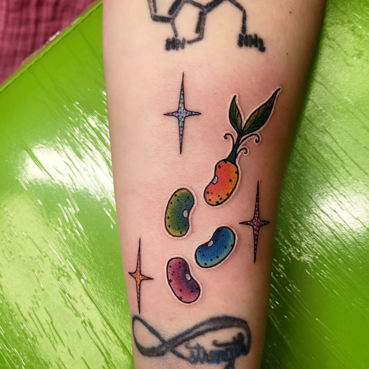 Bean sprout dotwork tattoo on the forearm by Wray Saulsberry