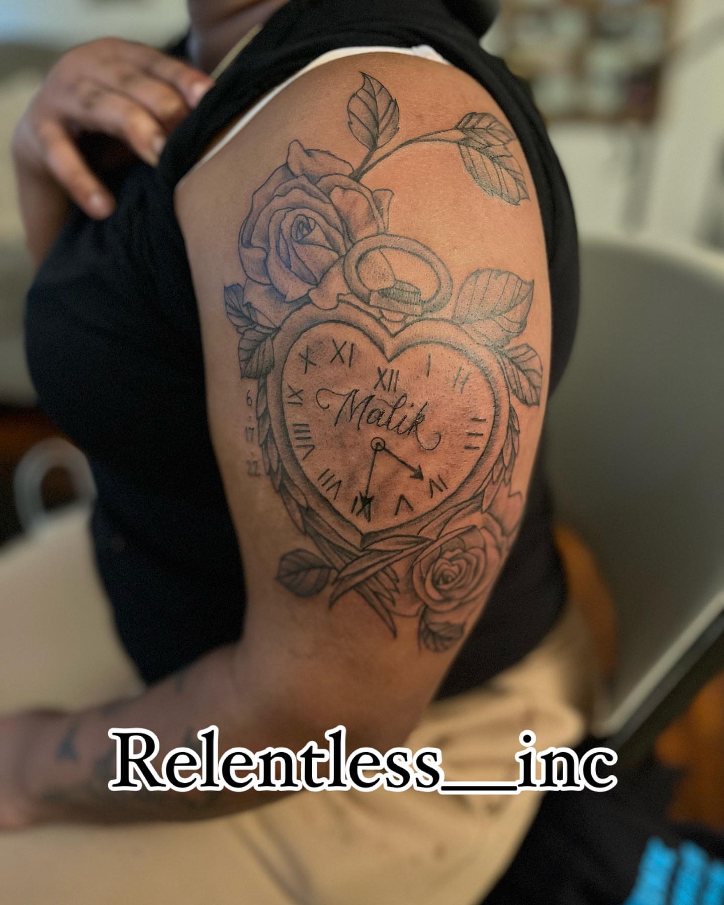 Heart clock black and grey tattoo on the shoulder by Aja Marie