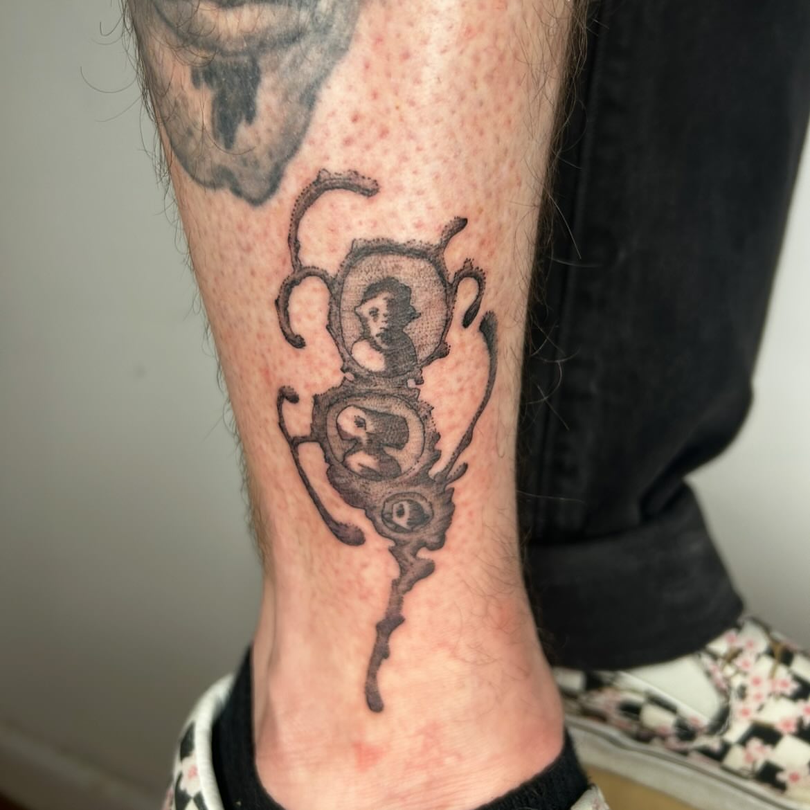 Portrait black and grey tattoo on the calf by Jadin Nichols