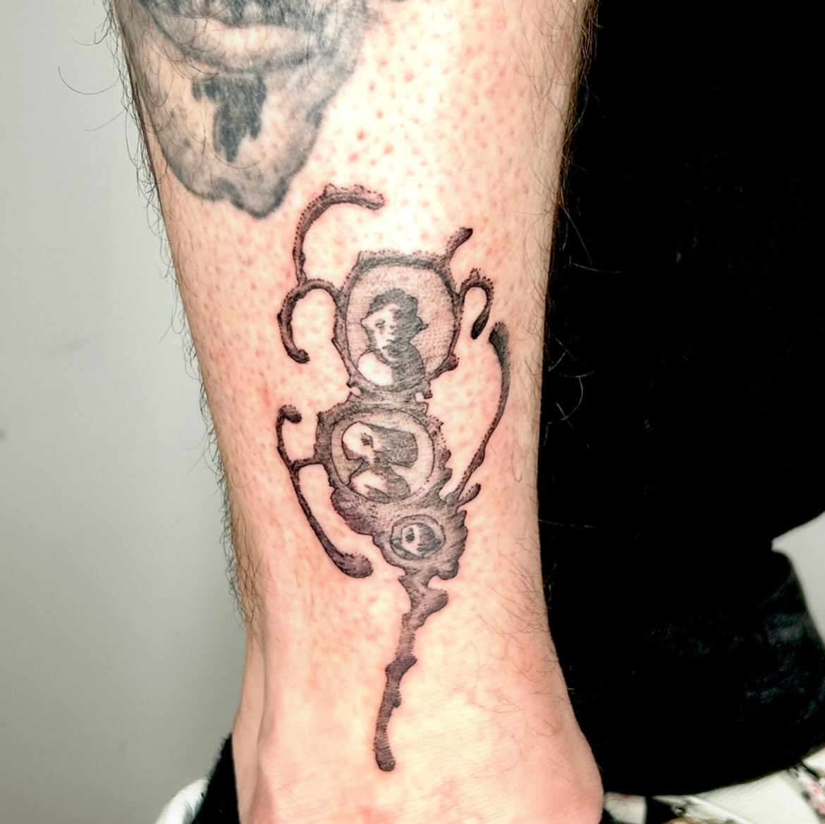 Portrait black and grey tattoo on the leg by Jadin Nichols