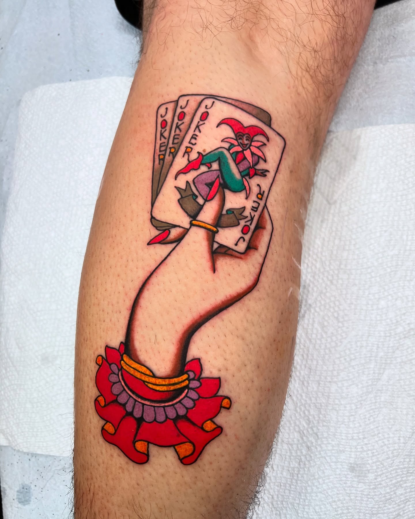 Joker cards American traditional tattoo on the forearm by superteal