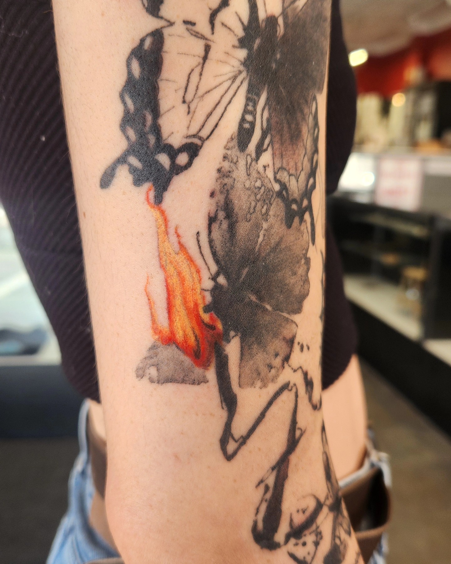 Fire and butterfly dotwork tattoo on the forearm by Samantha Von Zombia, Saint Paul, Minnesota