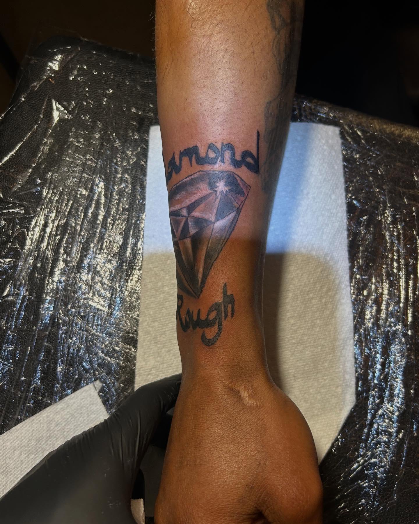 Diamond rough realism tattoo on the forearm by Illuminink.gallery