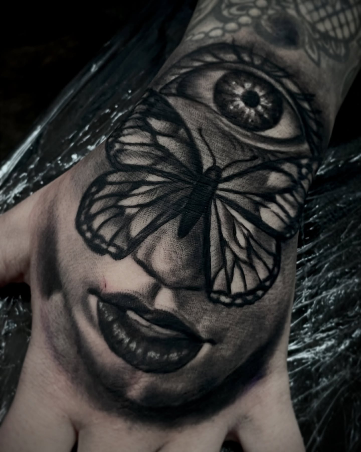 Woman's face realism tattoo on the forearm by Frank Mostek