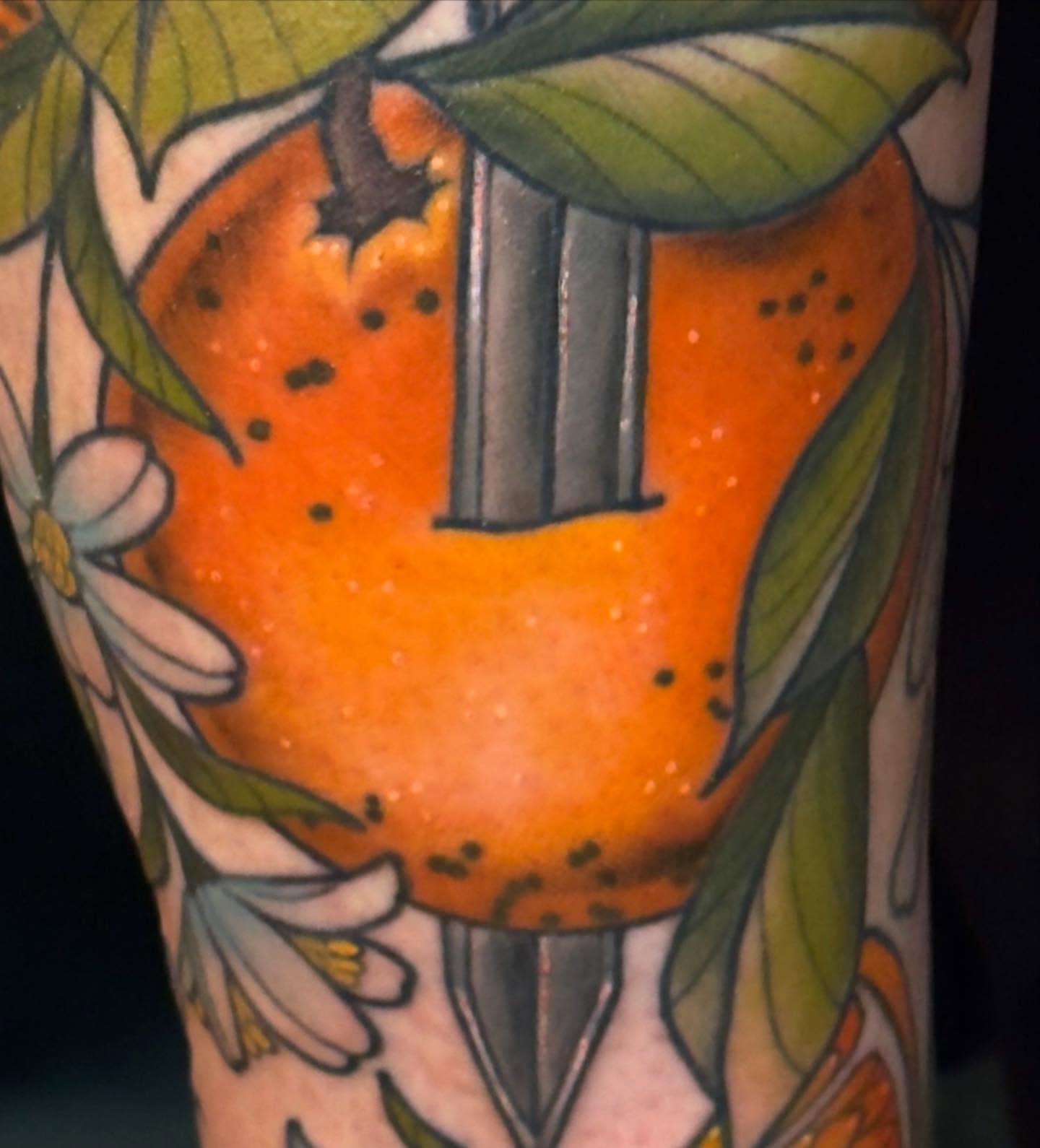 Orange with knife dotwork tattoo on the forearm by Jessica Haug