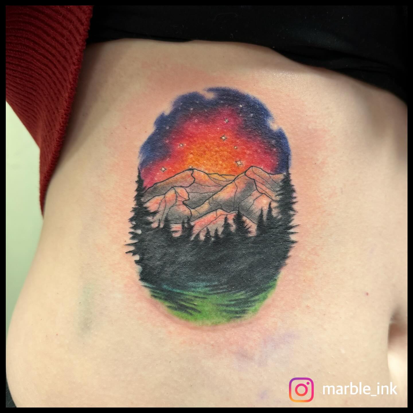Mountain landscape realism tattoo on the ribs by Darbi "Marbles"