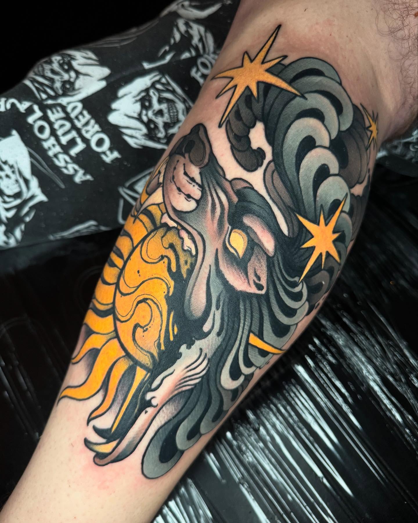 Sun and waves American traditional tattoo on the forearm by Freddie Brown, Lombard, IL
