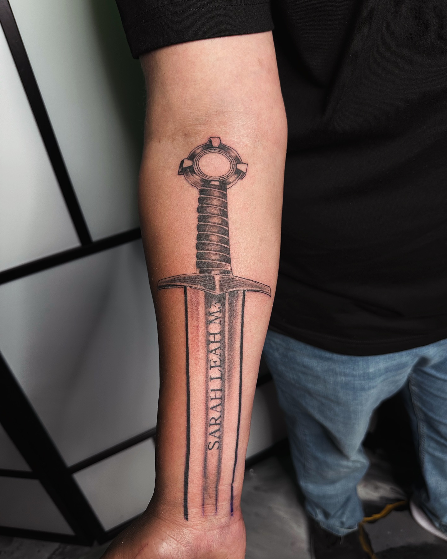 Sword black and grey tattoo on the forearm by 📍 Austin