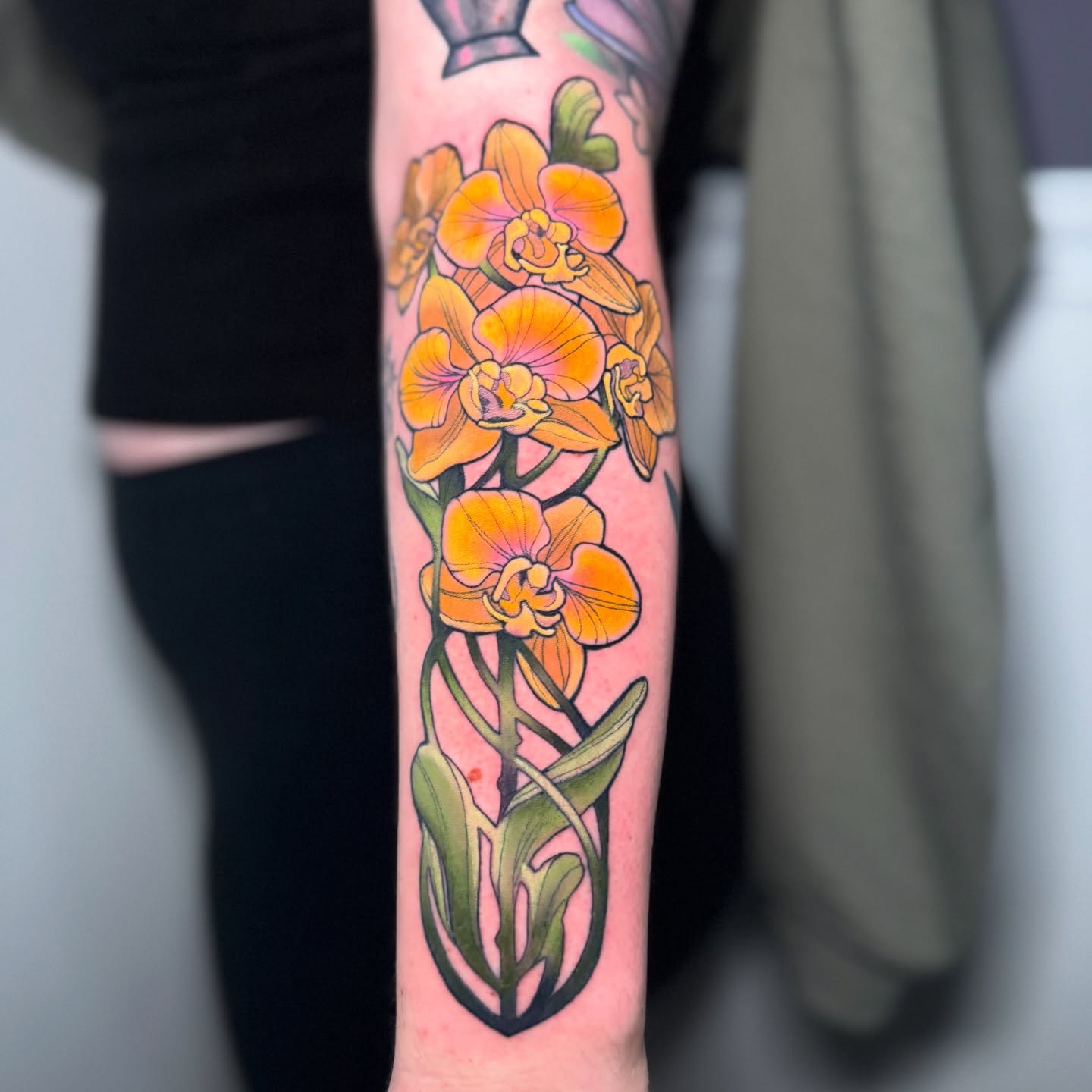 Orchids new school tattoo on the forearm by Steve Gentile Tattoos