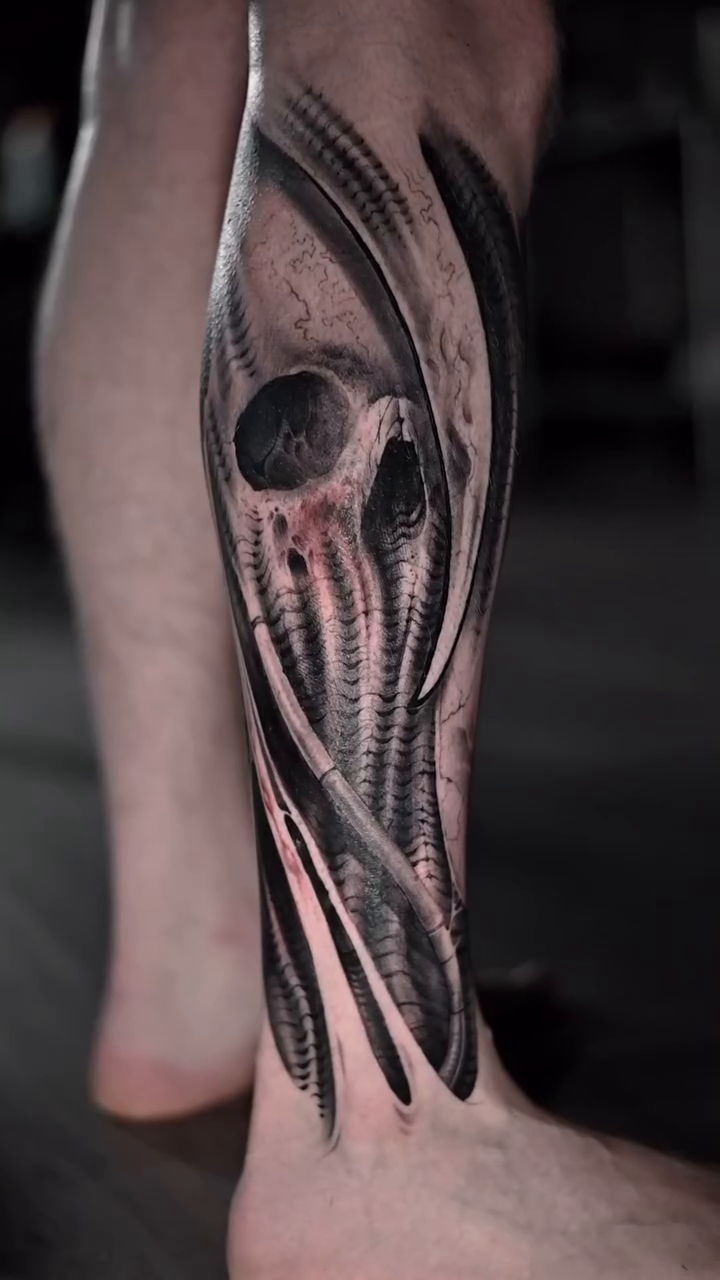 Biomechanical skull and muscle realism tattoo by Jerrel Larkins