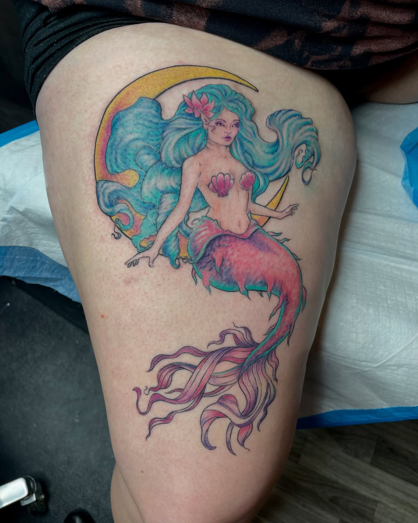 Mermaid new school tattoo on the thigh by Christin Baumgart