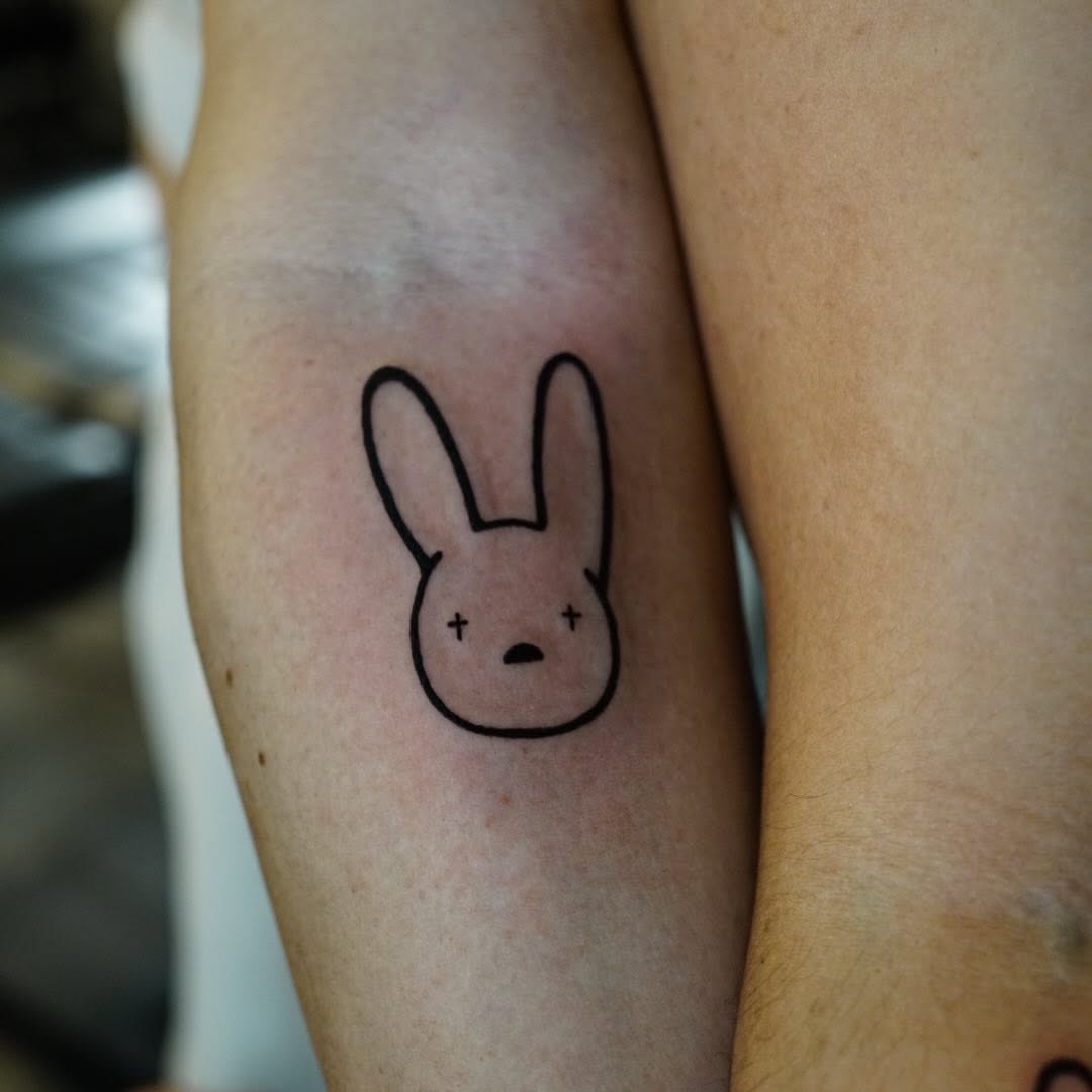 Bunny head new school tattoo on the forearm by chloe.mari_ink